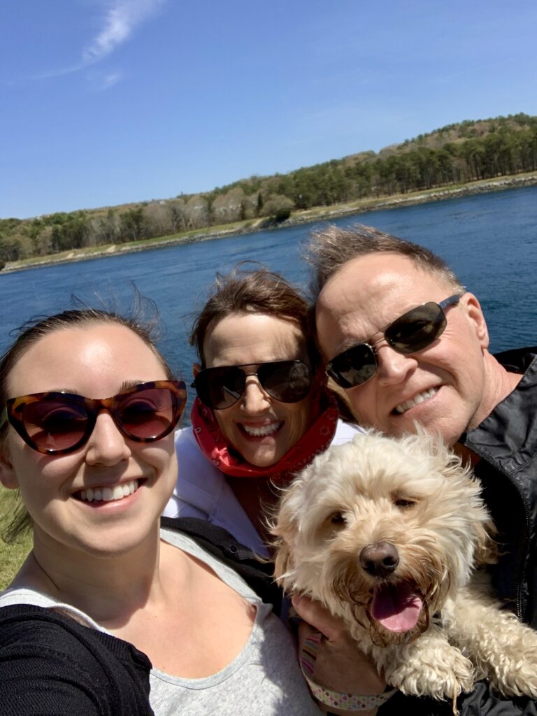 family next to a lake