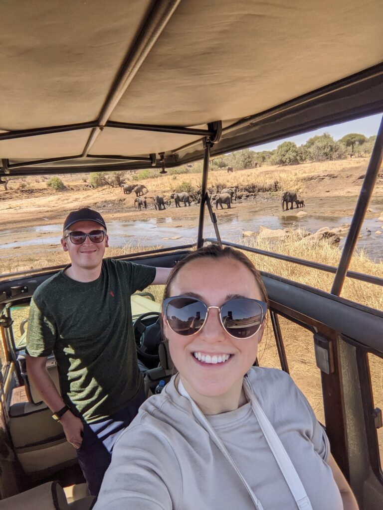 couple on safari with elephants